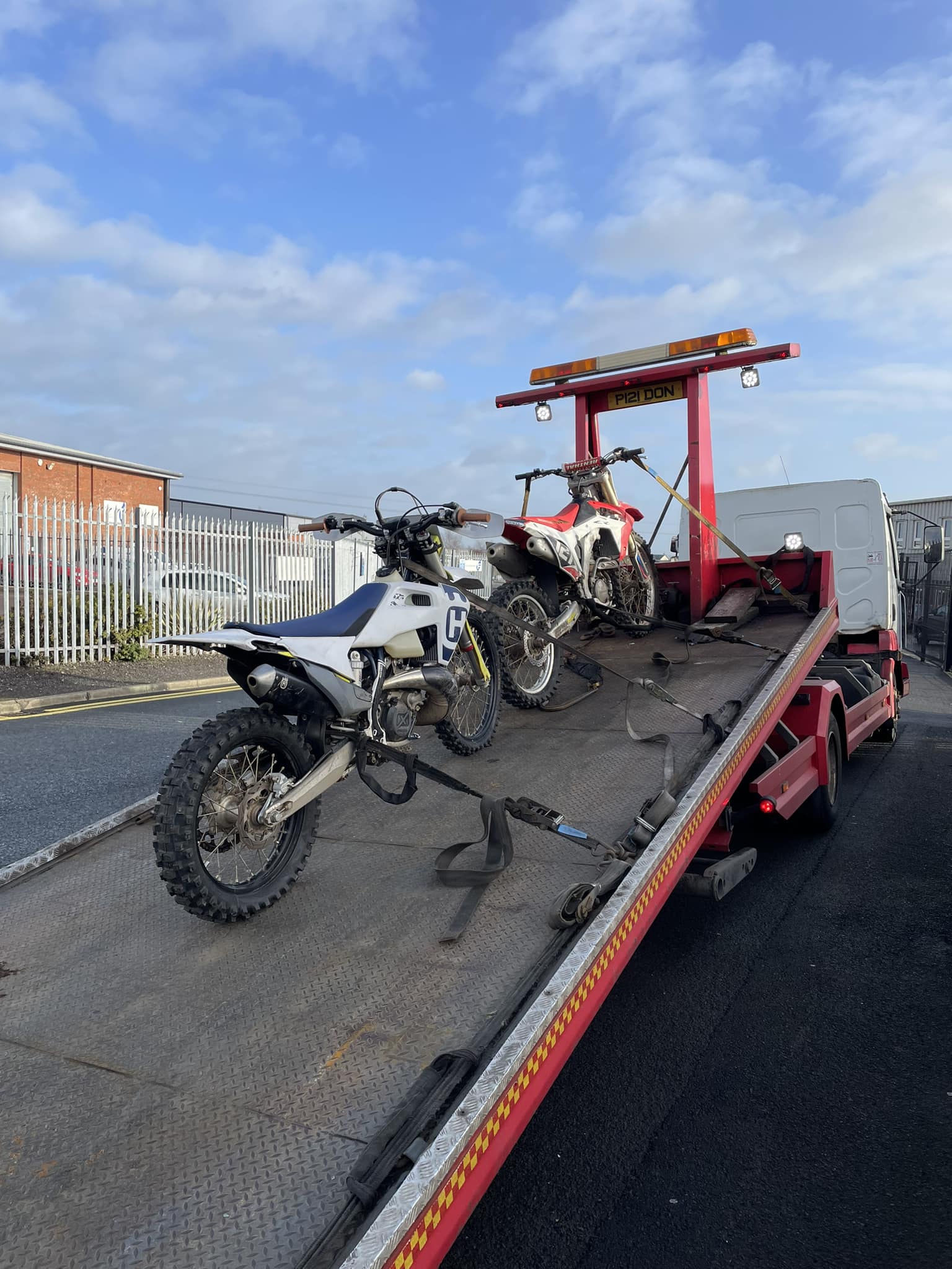 2 dirt bikes on recovery truck