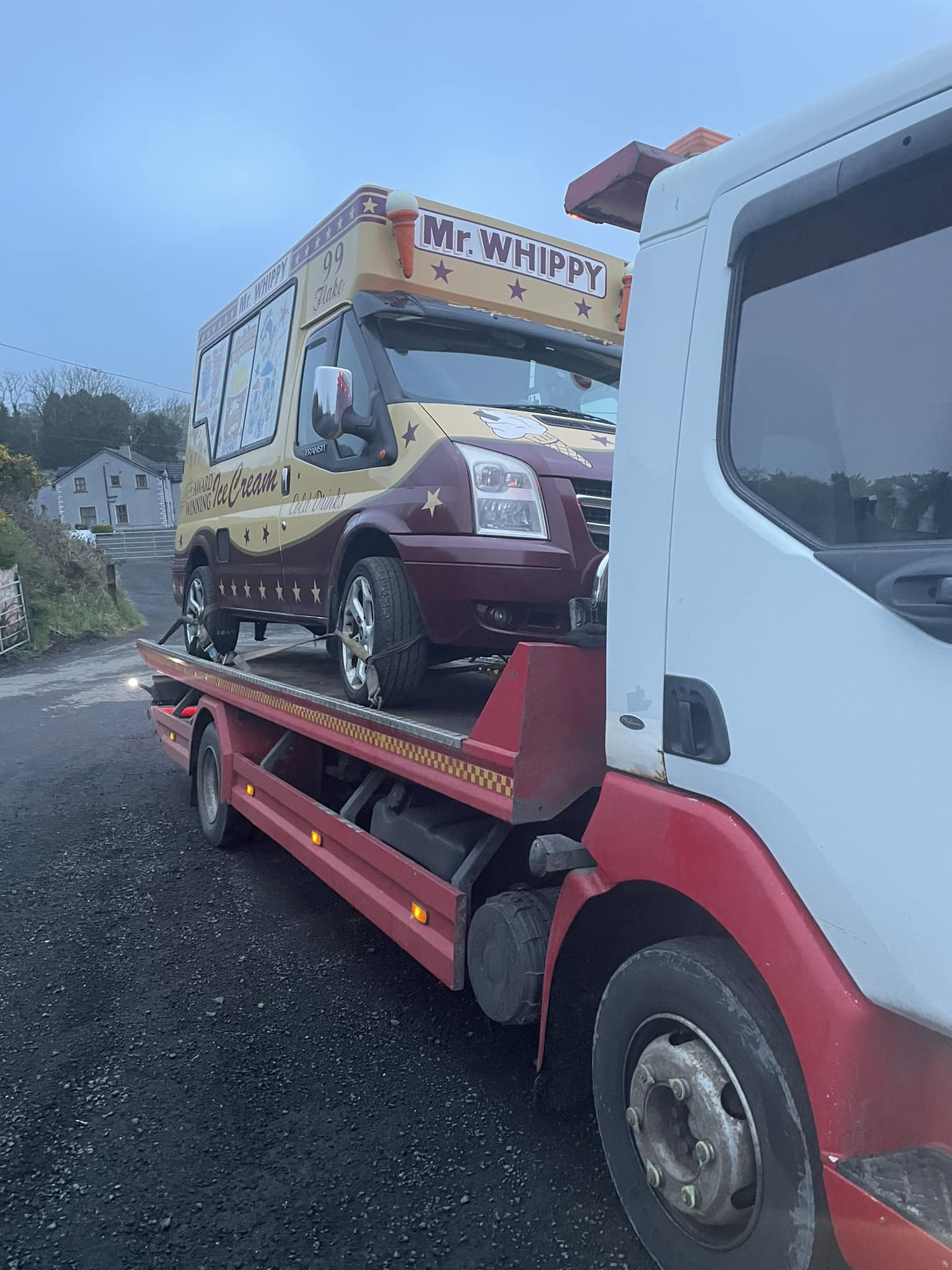 Ice cream van on recovery truck