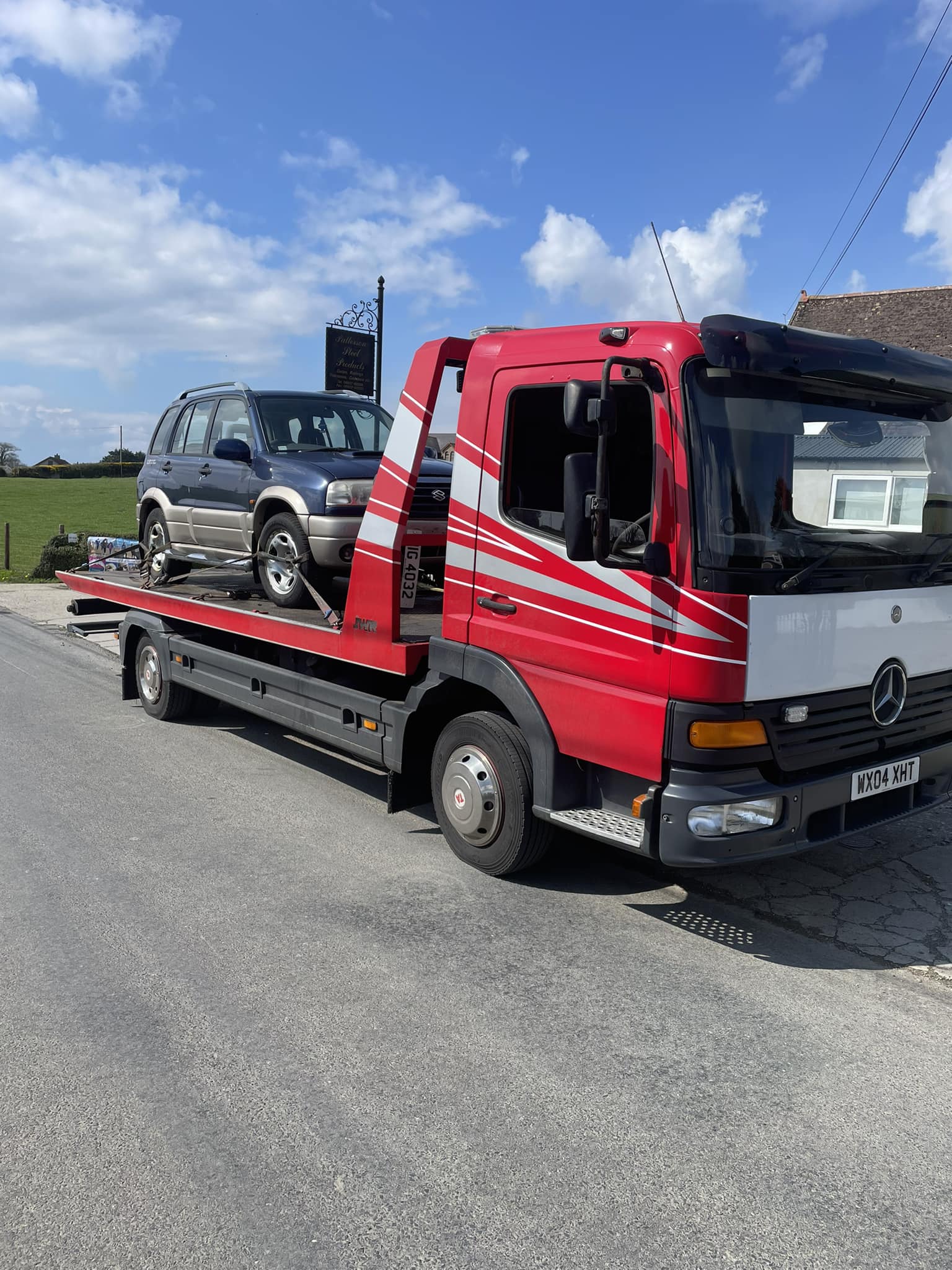 Suzuki jeep on recovery truck